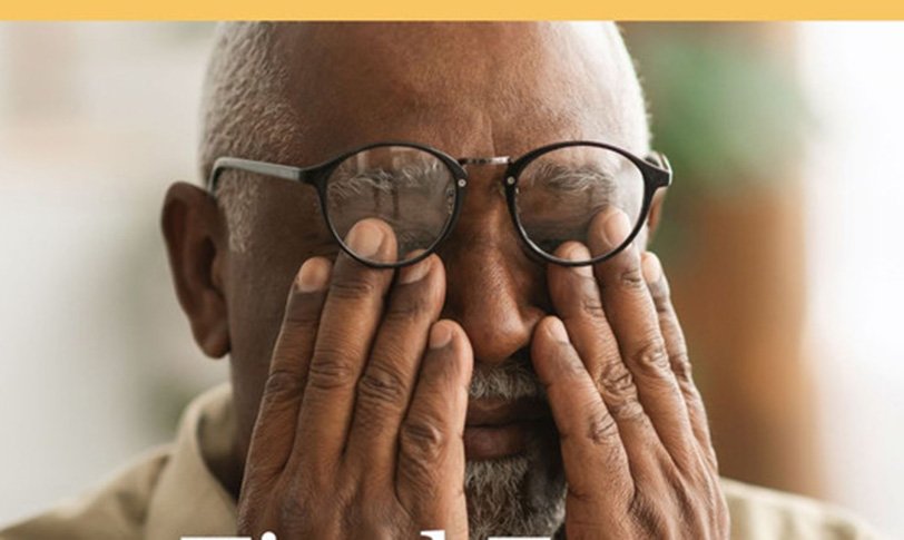Person Performing Palming Eye Exercise At Desk