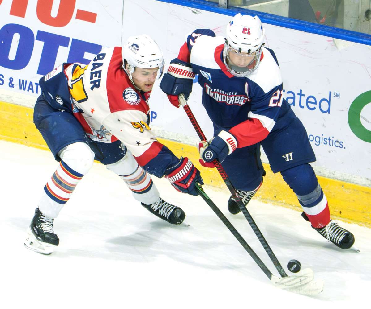 Peorias Alec Baer, Left, Battles For The Puck With Evansvilles Myles Abbate In The Second Period Of Their Sphl Hockey Game